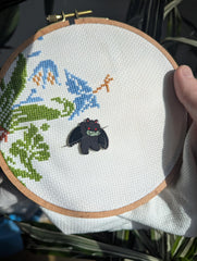 GingerStitchAu Mothman Needle Minder displayed on craft table