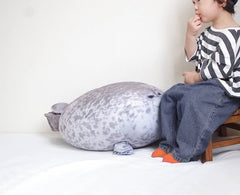 Chubby blob seal plush design with vivid eyes and nose