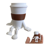 3D printed coffee cup figurine with articulated legs on desk