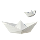 3D printed paper boat figurine on desk