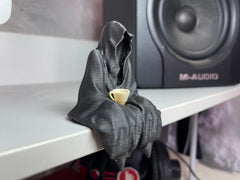 Compact ghost figurine dimensions 3in x 2in x 1.5in on desk