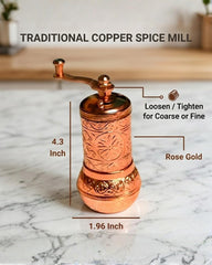 Close up of hand-engraved floral and rose motifs on copper surface