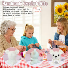 Small knitted white polar bear plush on desk
