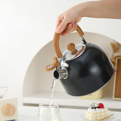 Tea kettle with auzzer tip for safe pouring