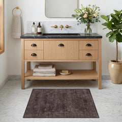 Low-pile 0.25 inch rug passes under doors easily