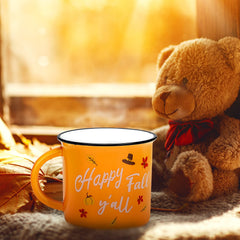 Orange pumpkin design with maple leaves on mug