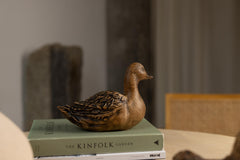 Hand-carved beech wood duck figurine with natural grain