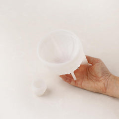 Domed textured silicone mold with pom-pom top for single serving bento cakes