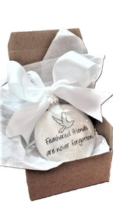 3 inch round glass Bird Memorial Ornament filled with white feathers