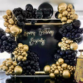 Black and gold balloon garland arch kit components