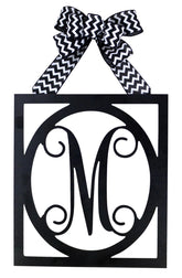 Black monogram door hanger with color customization on wood and bow