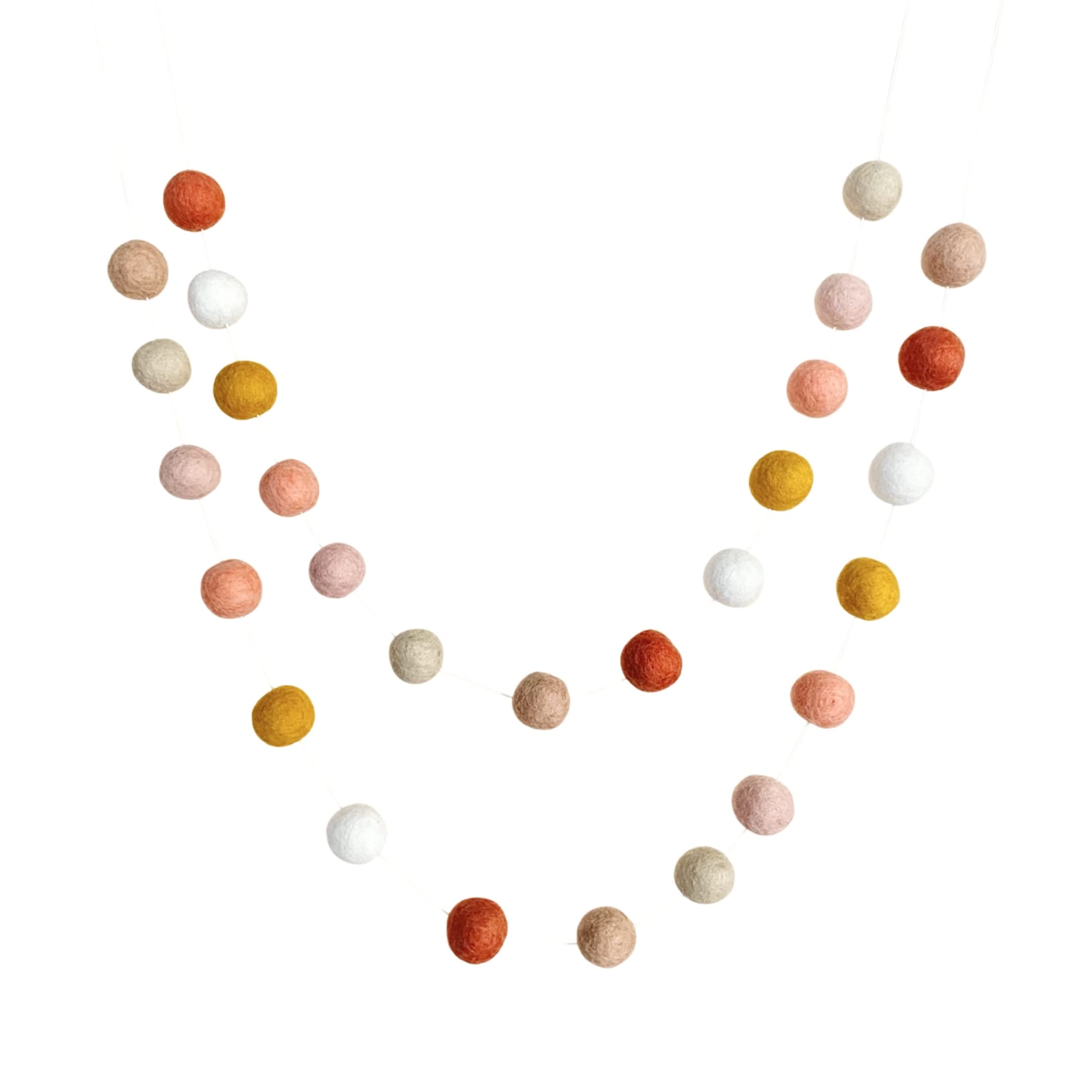 BoHo Rainbow handmade wool felt ball garland colors close up coral peach cream