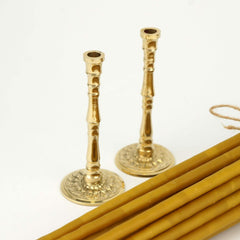 Pair of brass holders with 20 beeswax candles included