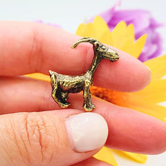 Tiny brass goat figurine for desk display