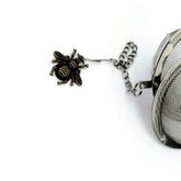 Bronze Bee charm on stainless steel tea infuser ball