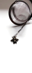Sturdy clamp keeps infuser ball securely closed for reuse
