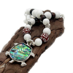 White wood beads with burgundy accent beads on each tieback