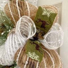 Burlap snowflake ribbon with green accents on wreath
