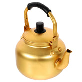 Cabilock yellow aluminum tea kettle on stove