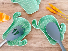 Close-up of green cactus ceramic spoon rest