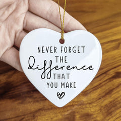 Double-sided ceramic heart ornament hanging with twine
