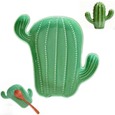 Ceramic spoon rest on stove top with green cactus design