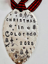 Mountains and stars design on a hand stamped spoon ornament