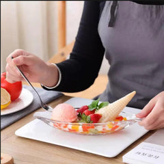 Boat-shaped glass dessert bowls with built-in handles