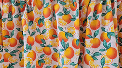 citrus themed orange blossom kitchen curtain print on pink background