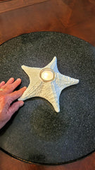 Handmade coastal decor candle holder with starfish motif
