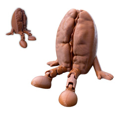 Coffee Bean Figurine with articulated legs on a desk