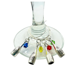 Close up of silver-tone wine bottle charm on a glass