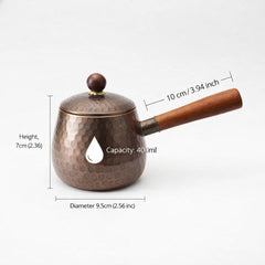 Copper tea kettle wooden handle closeup 3.74 inches