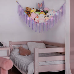 Corner-mounted toy hammock with wooden rings for kids room