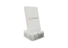 Close up of white Carrara marble card holder by Craftsman Stoneworks