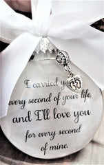 Hand-tied white satin bow atop the ornament