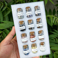 healing stones in a small bottle for chakra crystals