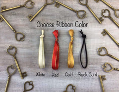 Durable metal ornament with customizable ribbon color option