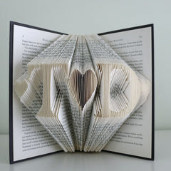 Custom two initials on folded paper book made from recycled pages