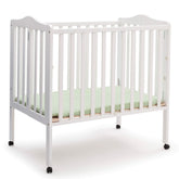 Delta Children folding portable mini baby crib white