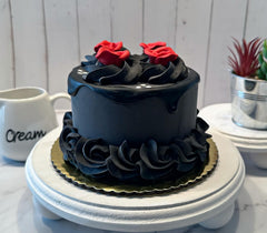 Fake cake black red drizzle close up by Dezicakes