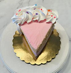 Pink sprinkle birthday cake slice on 6 inch cake board