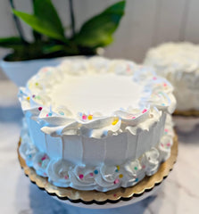 Fake cake dimensions 9 in wide by 4 in tall on a 10 in cake board