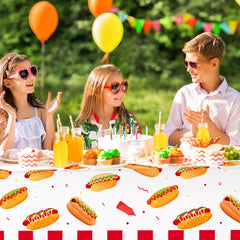 Six disposable tablecloths laid out for BBQ picnic use