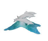 Dolphin Pod Sculpture by John Perry on a blue wave Pellucida base