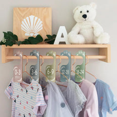 Month labeled closet dividers on wooden hanger image