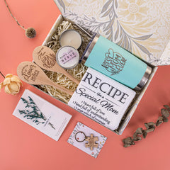 Gift basket contents including wooden keychain towel candle spoons
