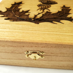 Engraved Scottish thistle design on wooden box