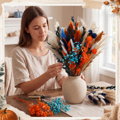 Rabbit tail and berry stems among dried flowers for fall decor