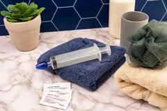 Nose rinse kit components swirl stream tip and syringe